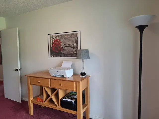 a workspace with furniture and wooden floor