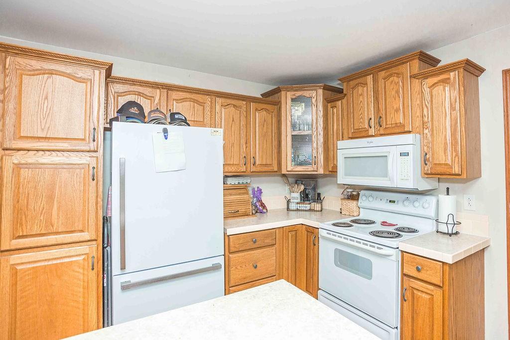 775 Clay Pike Road New Florence, PA 15944 - Photo 17 of 48 a kitchen with a refrigerator a sink and a stove