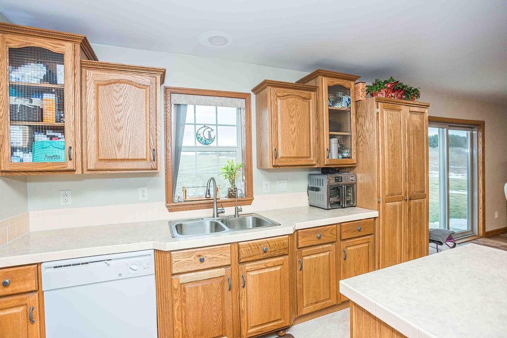 775 Clay Pike Road New Florence, PA 15944 - Photo 18 of 48 a kitchen with stainless steel appliances wooden cabinets a sink and a window