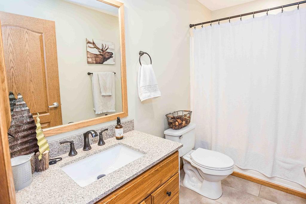 775 Clay Pike Road New Florence, PA 15944 - Photo 23 of 48 a bathroom with a sink a toilet and a mirror