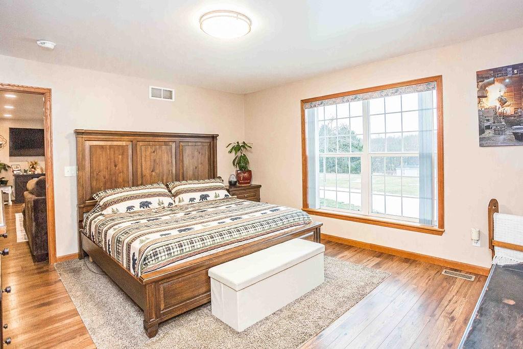 775 Clay Pike Road New Florence, PA 15944 - Photo 27 of 48 a bedroom with a bed lamp and a large window