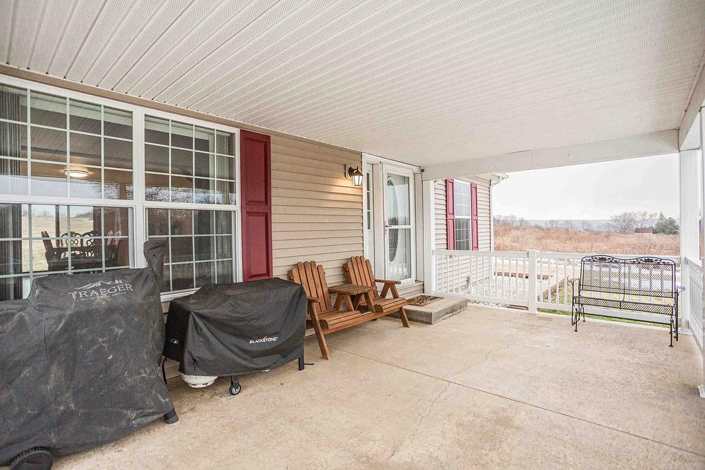 775 Clay Pike Road New Florence, PA 15944 - Photo 6 of 48 a living room with furniture and a floor to ceiling window