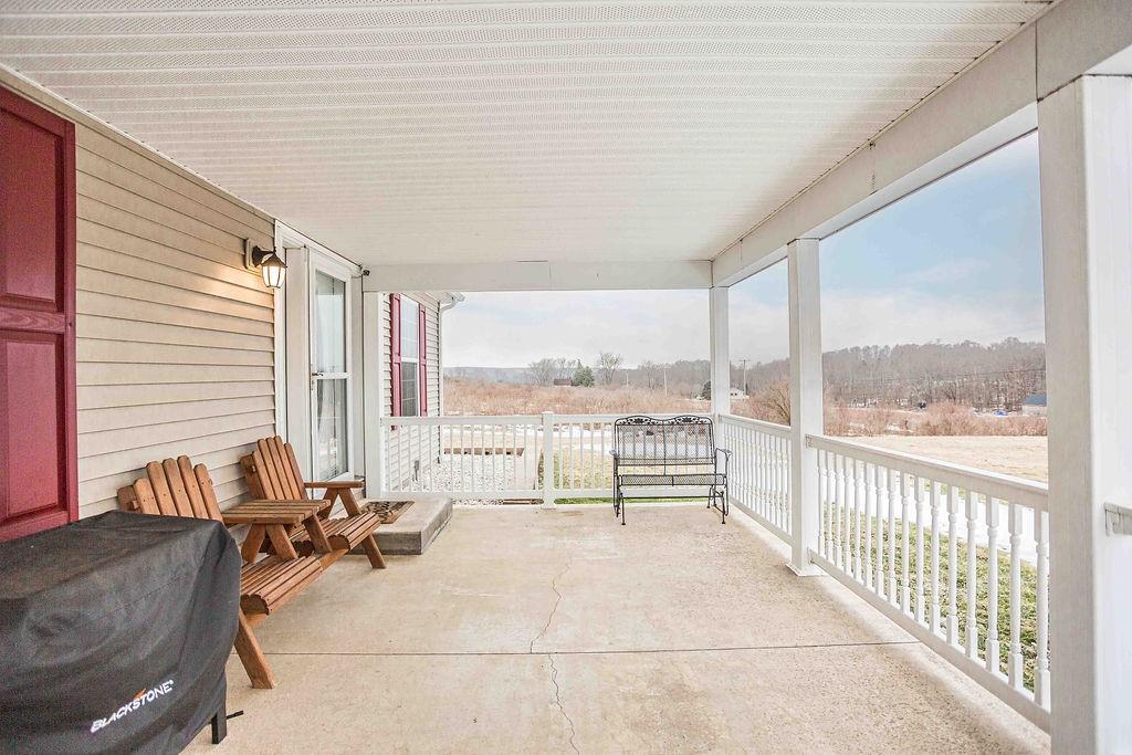 775 Clay Pike Road New Florence, PA 15944 - Photo 7 of 48 a living room with furniture and floor to ceiling windows