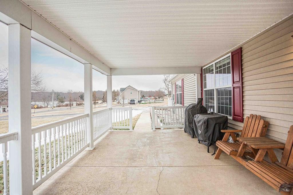 775 Clay Pike Road New Florence, PA 15944 - Photo 8 of 48 a living room with furniture and floor to ceiling windows