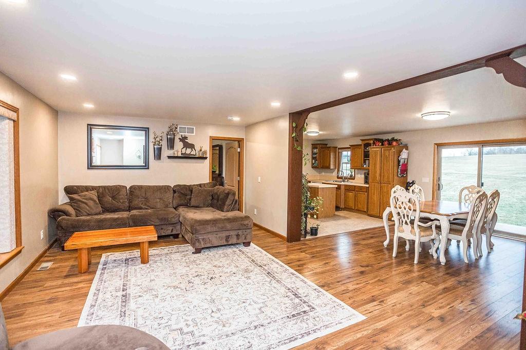 775 Clay Pike Road New Florence, PA 15944 - Photo 10 of 48 a living room with furniture and a dining table with wooden floor
