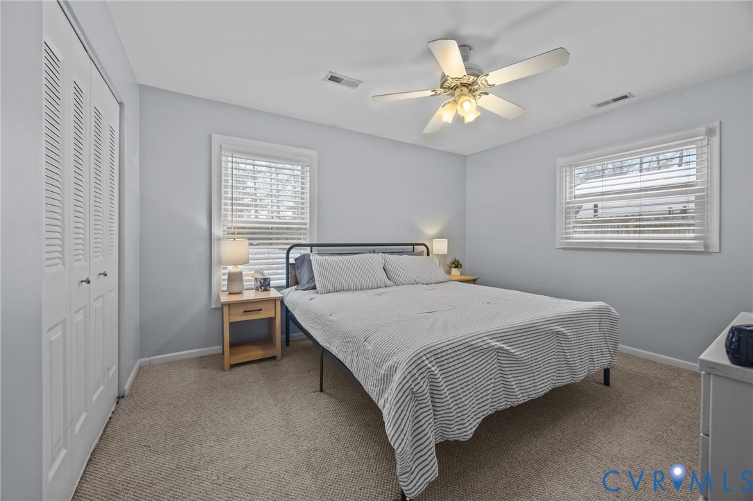 5212 Rollingway Road Chesterfield, VA 23832 - Photo 13 of 25 a bedroom with a bed and a ceiling fan