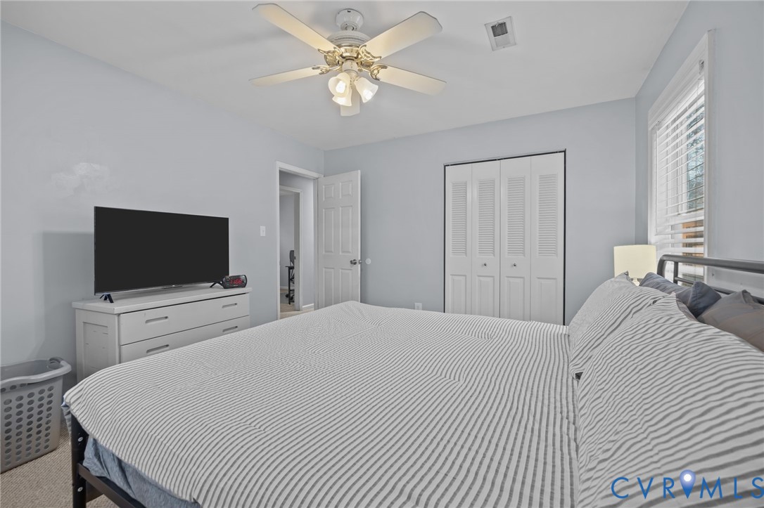 5212 Rollingway Road Chesterfield, VA 23832 - Photo 15 of 25 a bedroom with a bed and a flat screen tv