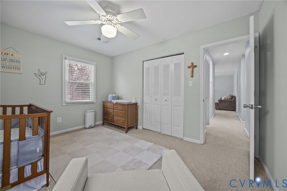 5212 Rollingway Road Chesterfield, VA 23832 - Photo 17 of 25 a view of an empty room with a window and a bedroom