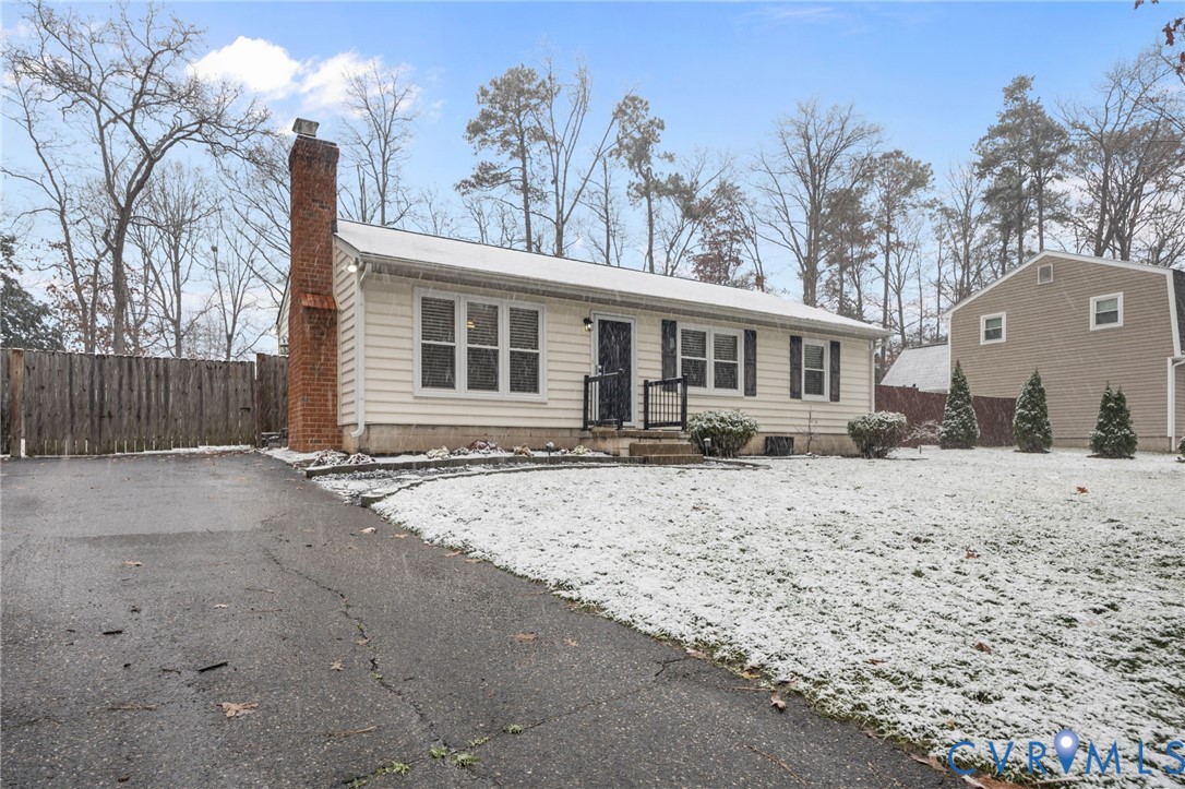 5212 Rollingway Road Chesterfield, VA 23832 - Photo 2 of 25 a front view of a house with a yard covered with snow