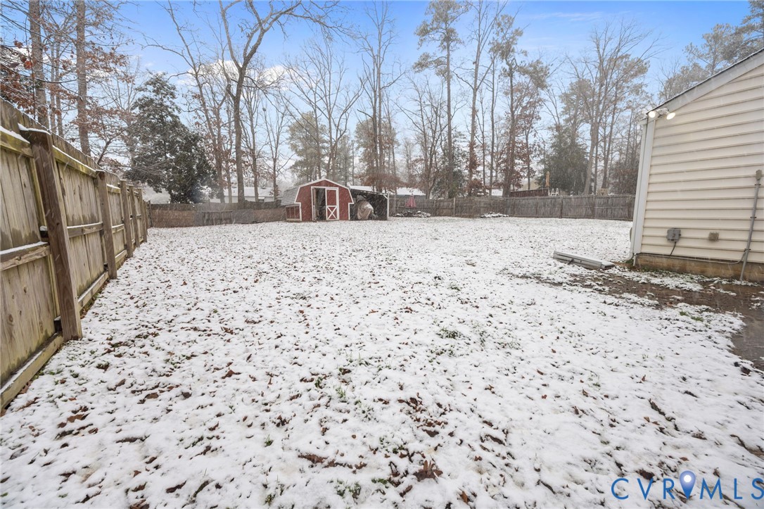 5212 Rollingway Road Chesterfield, VA 23832 - Photo 21 of 25 a view of a yard covered in snow