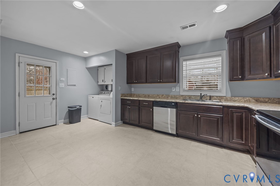 5212 Rollingway Road Chesterfield, VA 23832 - Photo 7 of 25 a kitchen with granite countertop a stove sink and cabinets