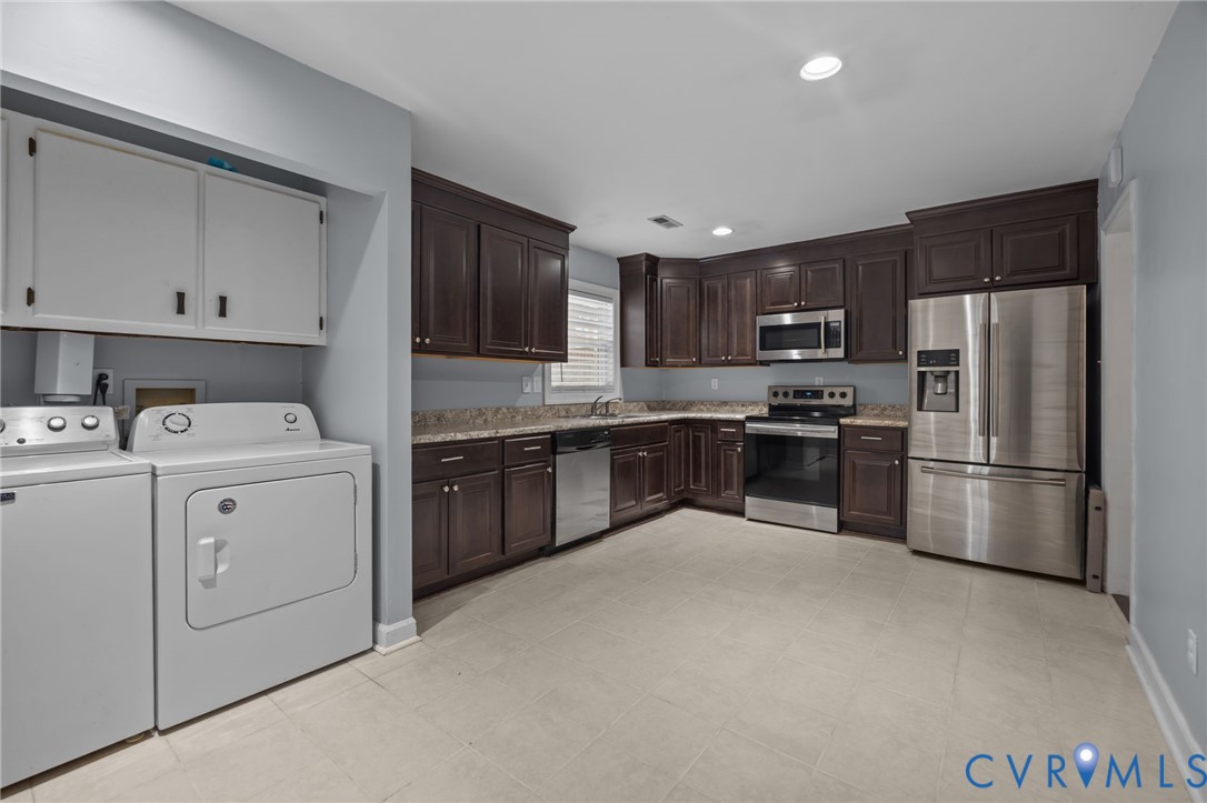 5212 Rollingway Road Chesterfield, VA 23832 - Photo 8 of 25 a kitchen with a refrigerator sink and cabinets