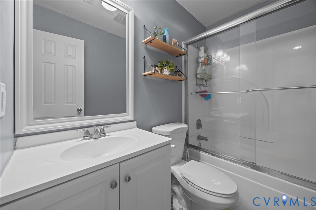 5212 Rollingway Road Chesterfield, VA 23832 - Photo 10 of 25 a bathroom with a sink toilet and shower