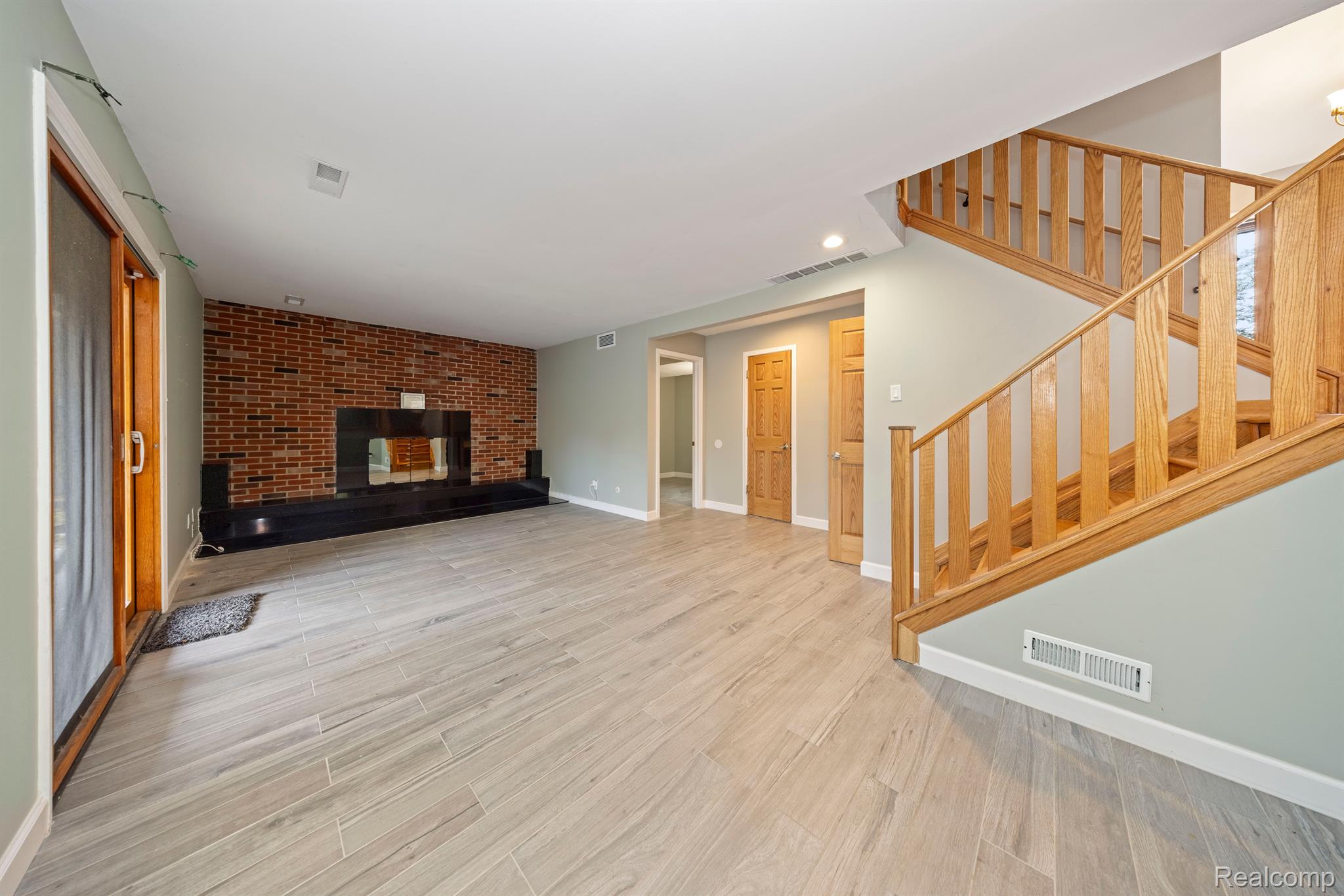 5731 Farmington Road West Bloomfield, MI 48322 - Photo 27 of 54 LL Family Room & Door Wall to Covered Patio