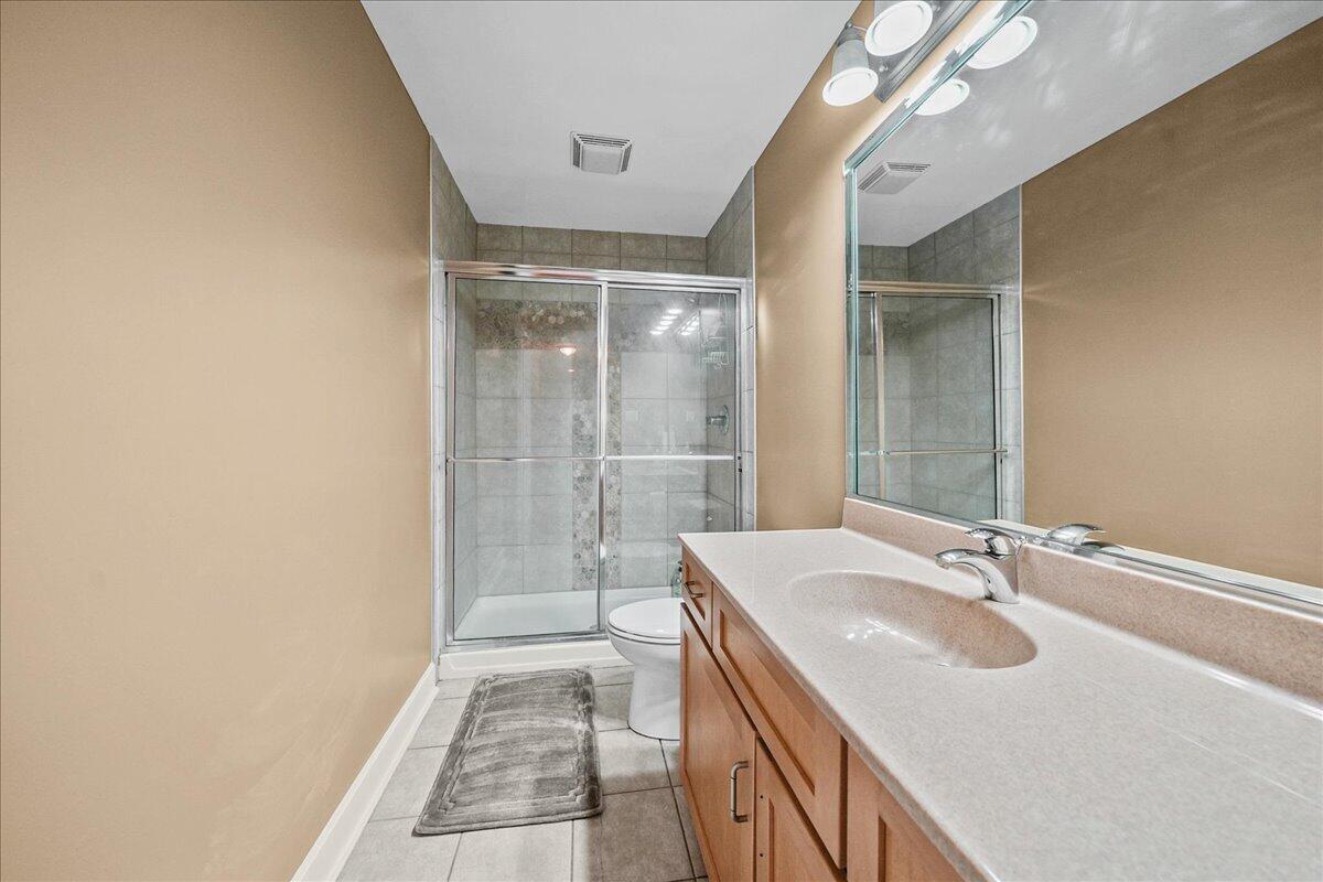 8751 Bridgewater Court Crown Point, IN 46307 - Photo 40 of 49 a bathroom with a sink and a mirror