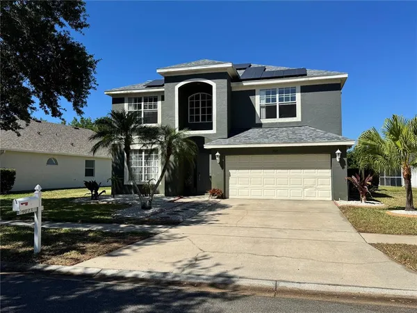 a front view of a house with garage