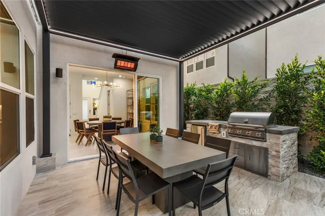 a view of a dining table and chairs in the balcony