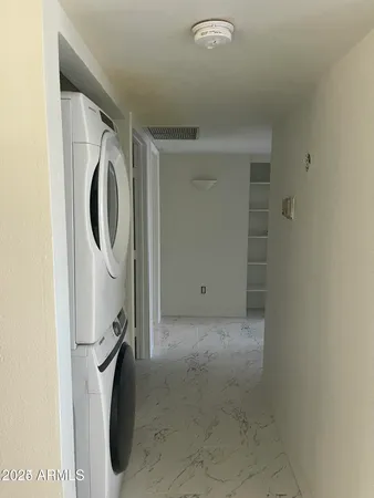 a view of a storage & utility room with a washer dryer