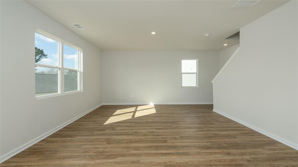 488 Bullock Pass Jefferson, GA 30549 - Photo 14 of 61 a view of empty room with wooden floor and fan