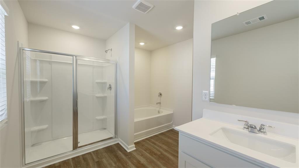 488 Bullock Pass Jefferson, GA 30549 - Photo 24 of 61 a bathroom with a shower and a sink
