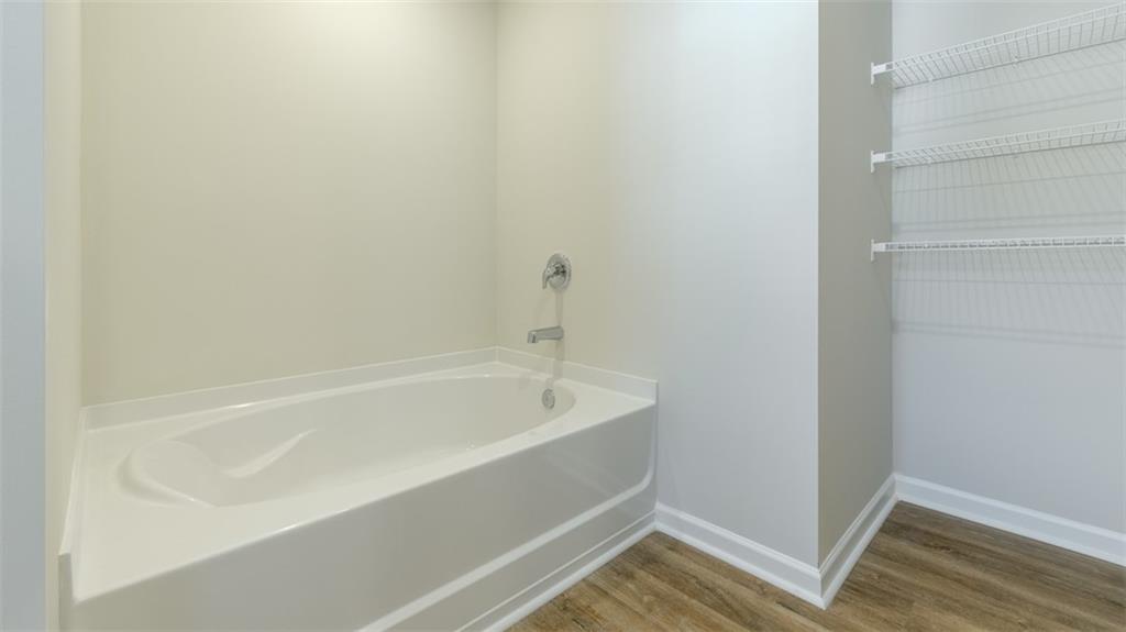 488 Bullock Pass Jefferson, GA 30549 - Photo 25 of 61 a bathroom with a bathtub