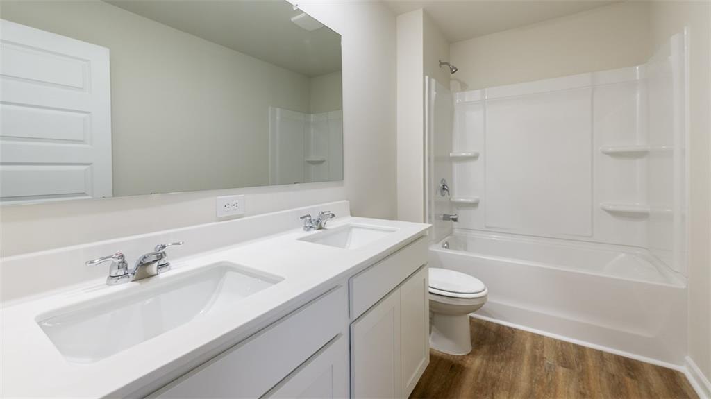 488 Bullock Pass Jefferson, GA 30549 - Photo 34 of 61 a bathroom with a sink toilet tub vanity and shower