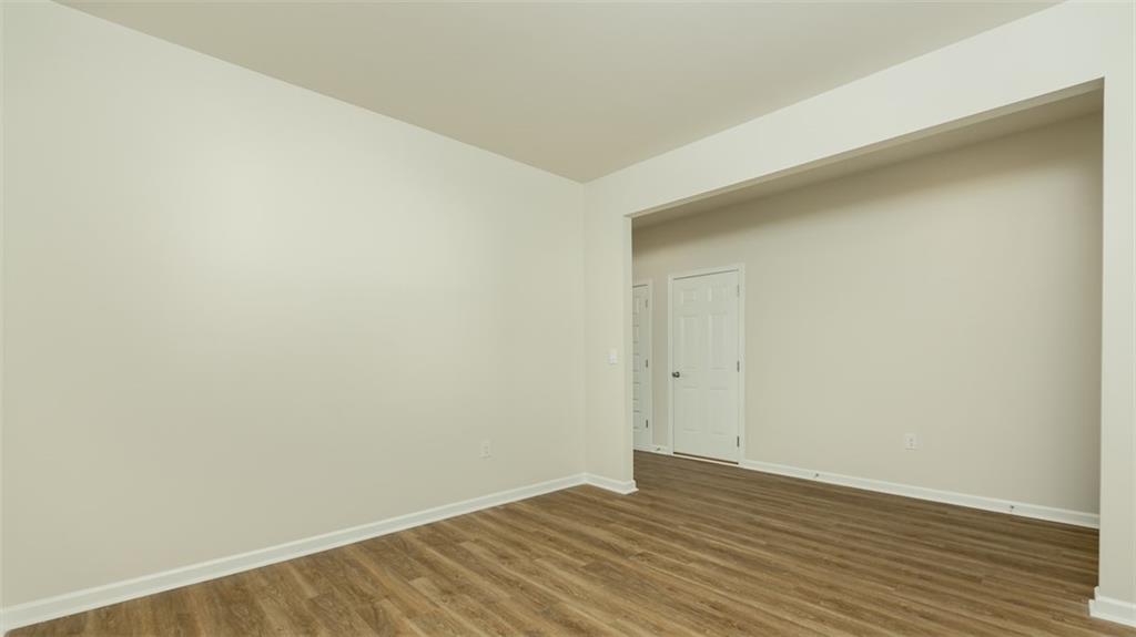 488 Bullock Pass Jefferson, GA 30549 - Photo 6 of 61 a view of an empty room with wooden floor