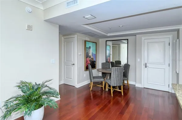 a view of a livingroom with furniture and a potted plant