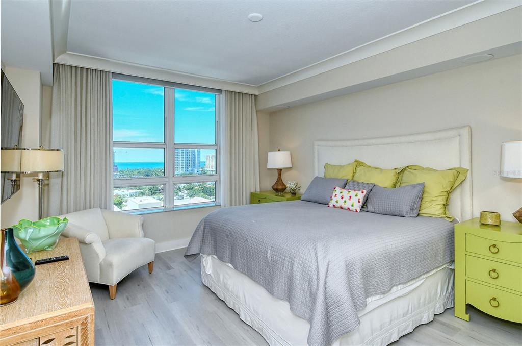 1350 Main Street, Unit 1202 Sarasota, FL 34236 - Photo 17 of 41 a bedroom with a bed and large windows
