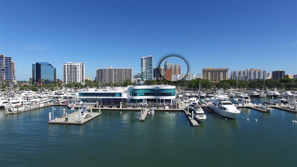 1350 Main Street, Unit 1202 Sarasota, FL 34236 - Photo 20 of 41 a view of a lake with boats and trees in the background