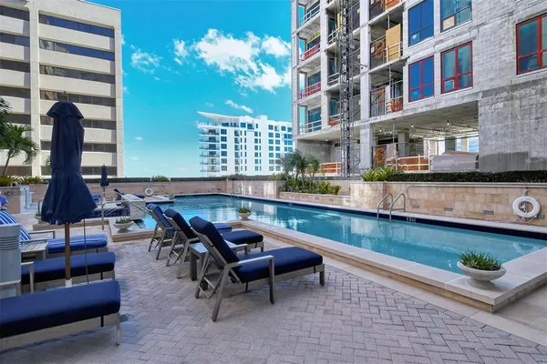 a building view with sitting space and swimming pool