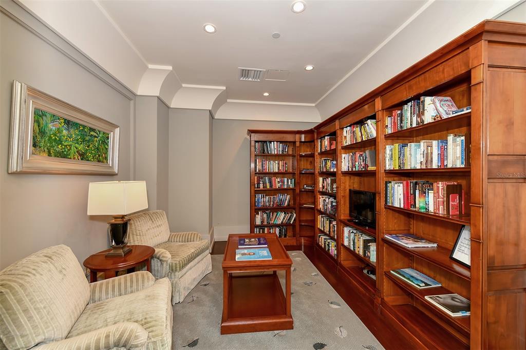 1350 Main Street, Unit 1202 Sarasota, FL 34236 - Photo 29 of 41 a room with furniture and a book shelf