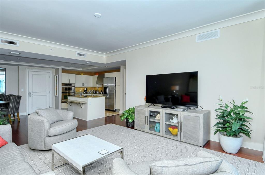1350 Main Street, Unit 1202 Sarasota, FL 34236 - Photo 9 of 41 a living room with furniture and a flat screen tv