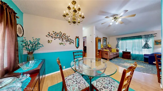 a living room with furniture a chandelier and a chandelier