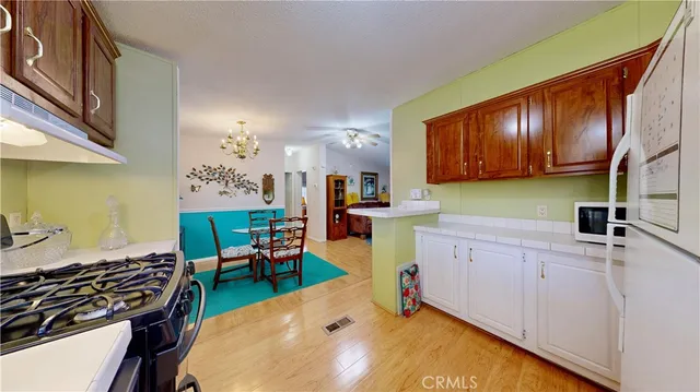 a kitchen with a sink and wooden cabinets