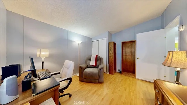 a workspace with furniture and a mirror