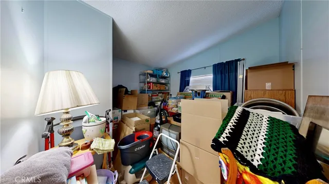 a view of living room with furniture and a wooden floor