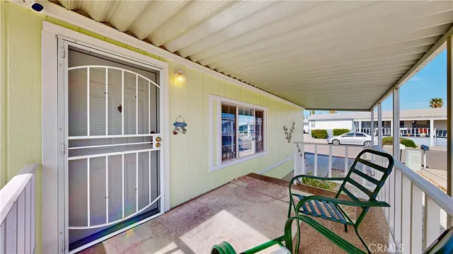 a view of a hallway with seating area