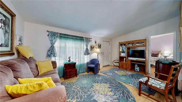 a living room with furniture flat screen tv and a fireplace