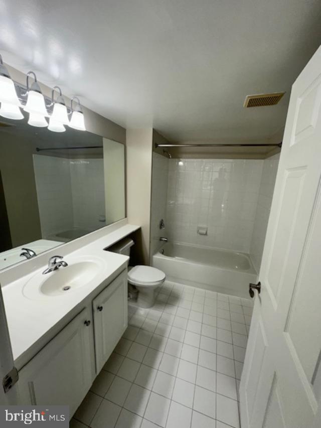 11710 Old Georgetown Road, Unit 212 North Bethesda, MD 20852 - Photo 11 of 23 a bathroom with a double vanity sink toilet and shower