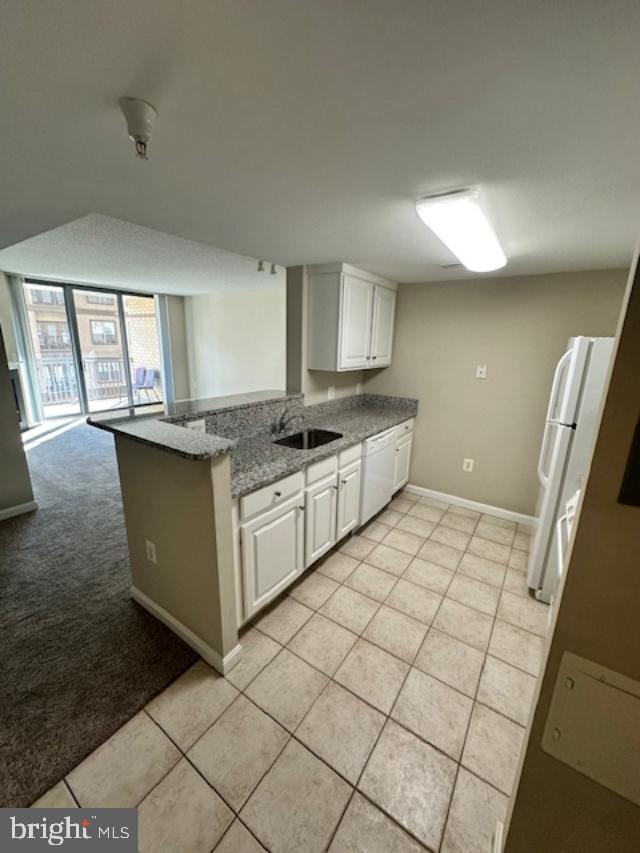 11710 Old Georgetown Road, Unit 212 North Bethesda, MD 20852 - Photo 3 of 23 a kitchen with stainless steel appliances granite countertop a sink and a stove