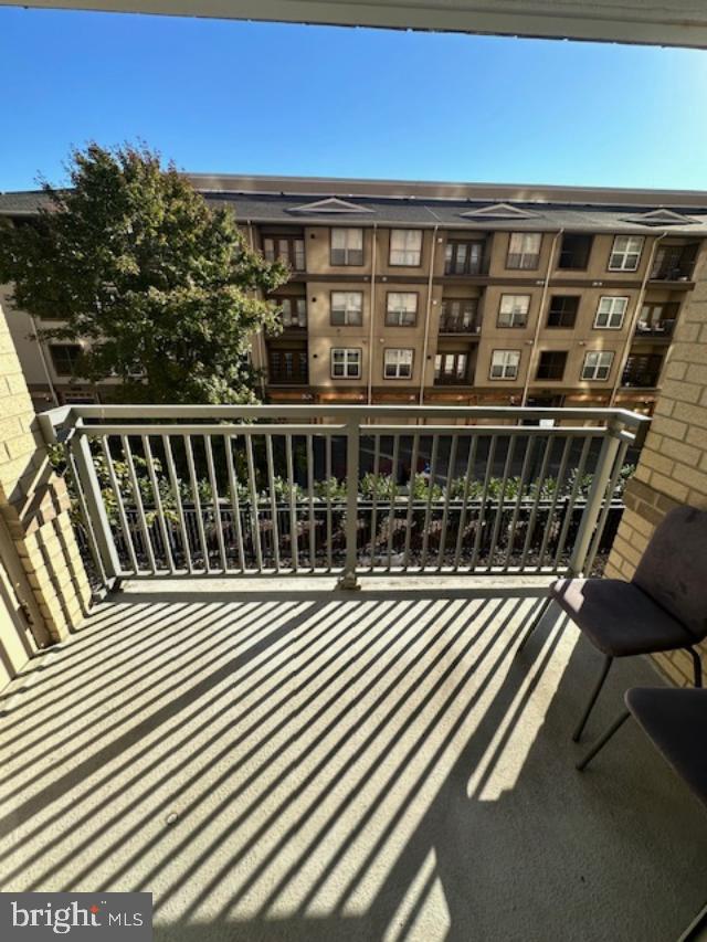 11710 Old Georgetown Road, Unit 212 North Bethesda, MD 20852 - Photo 6 of 23 a view of a balcony with wooden floor