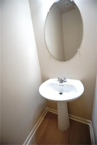 a view of a hallway with paintings on the wall