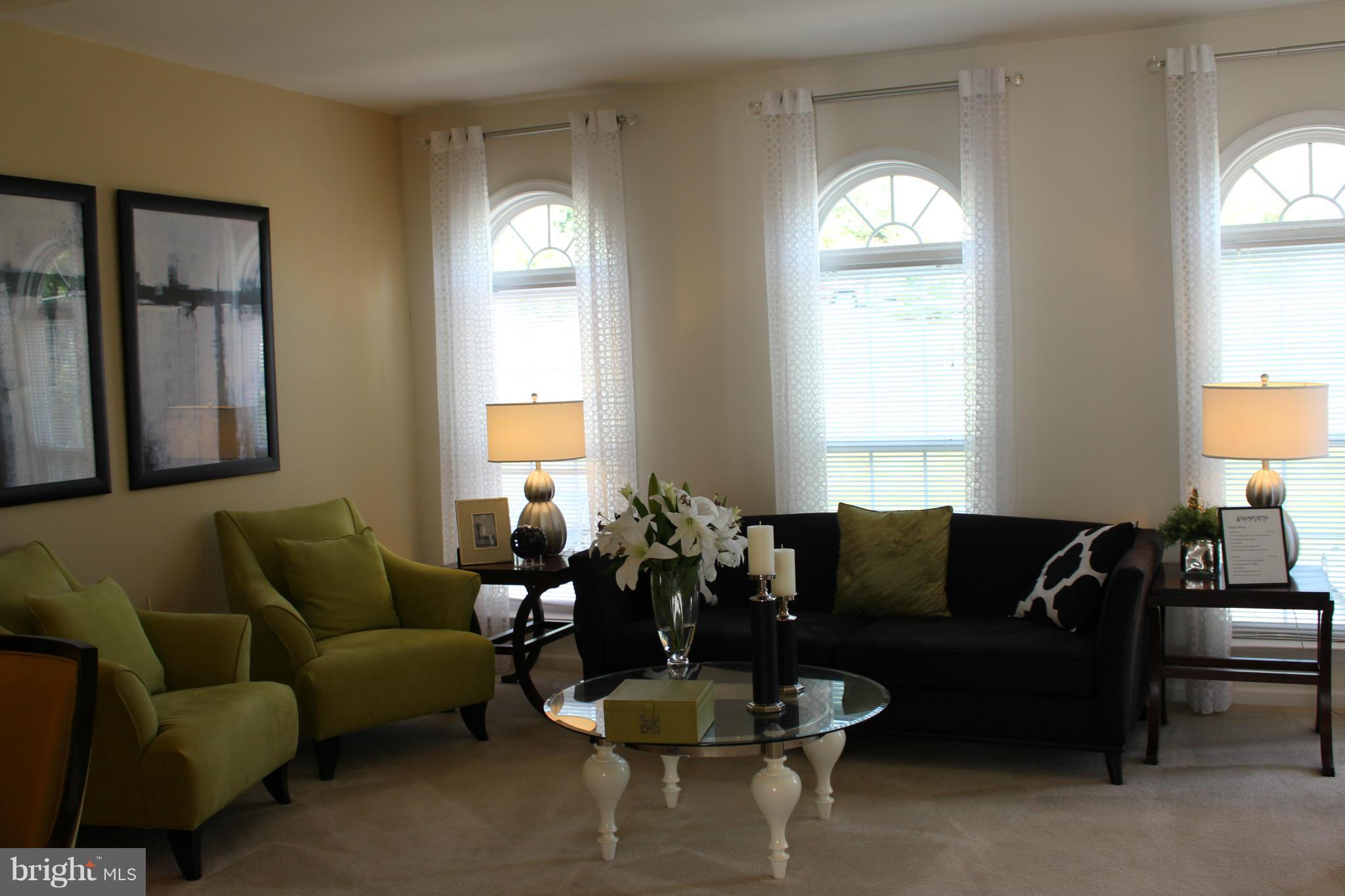 17690 Possum Point Road Dumfries, VA 22026 - Photo 5 of 7 a living room with furniture and a large window