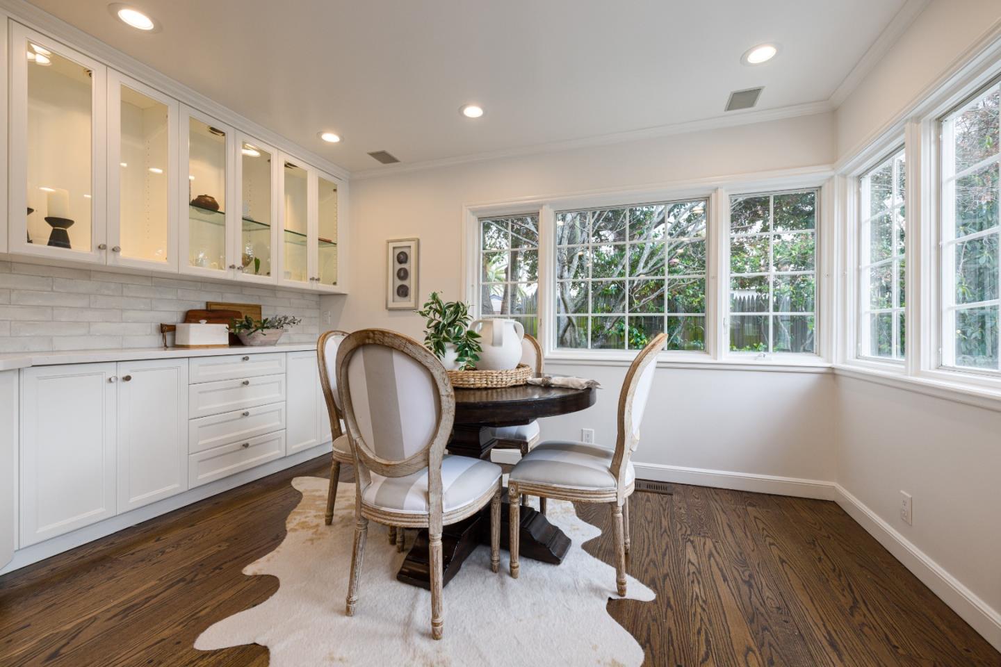 628 Alhambra Road San Mateo, CA 94402 - Photo 15 of 35 a view of a dining room with furniture window and wooden floor
