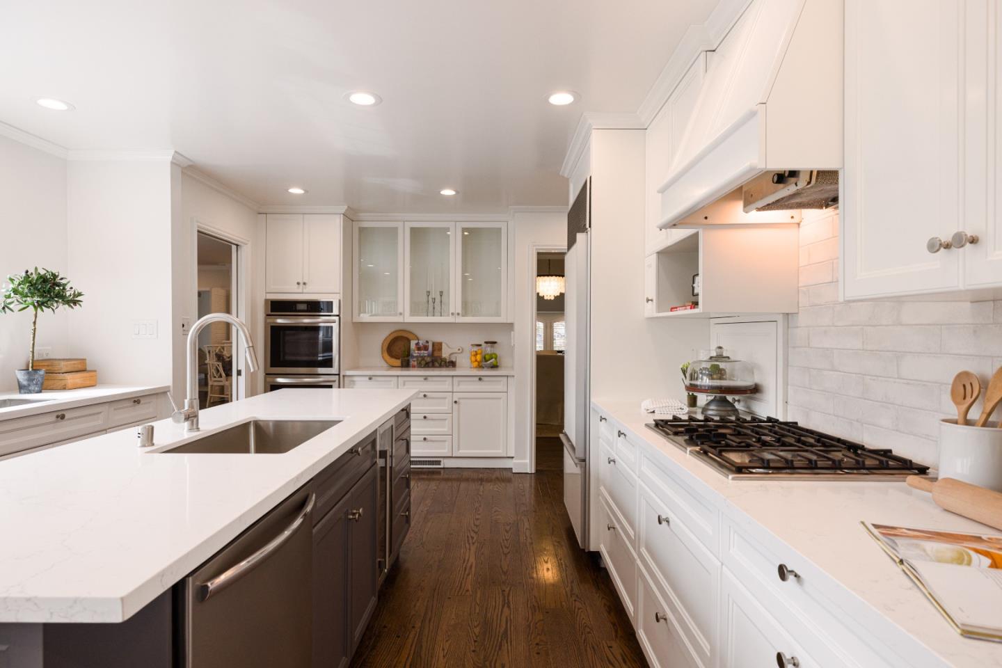 628 Alhambra Road San Mateo, CA 94402 - Photo 16 of 35 a kitchen with a sink stove and refrigerator
