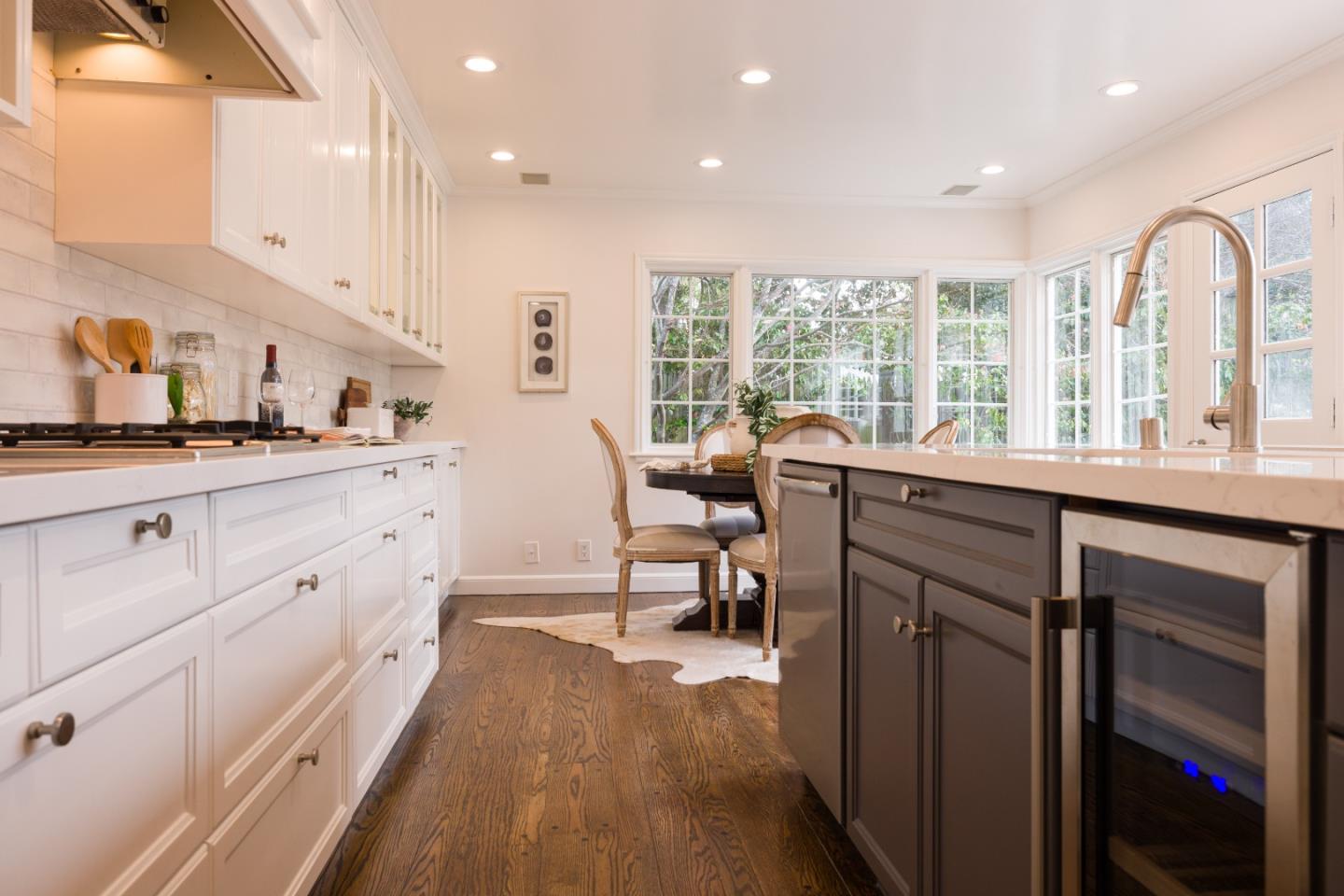 628 Alhambra Road San Mateo, CA 94402 - Photo 17 of 35 a view of a kitchen with kitchen island granite countertop a large window a sink and counter space