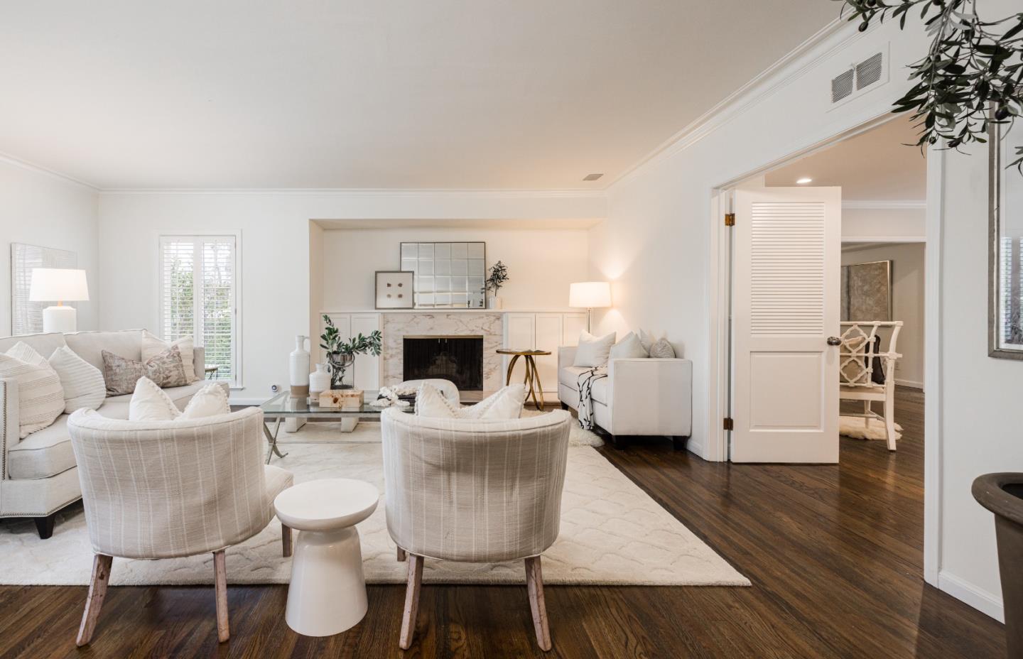 628 Alhambra Road San Mateo, CA 94402 - Photo 3 of 35 a living room with furniture a fireplace and a potted plant
