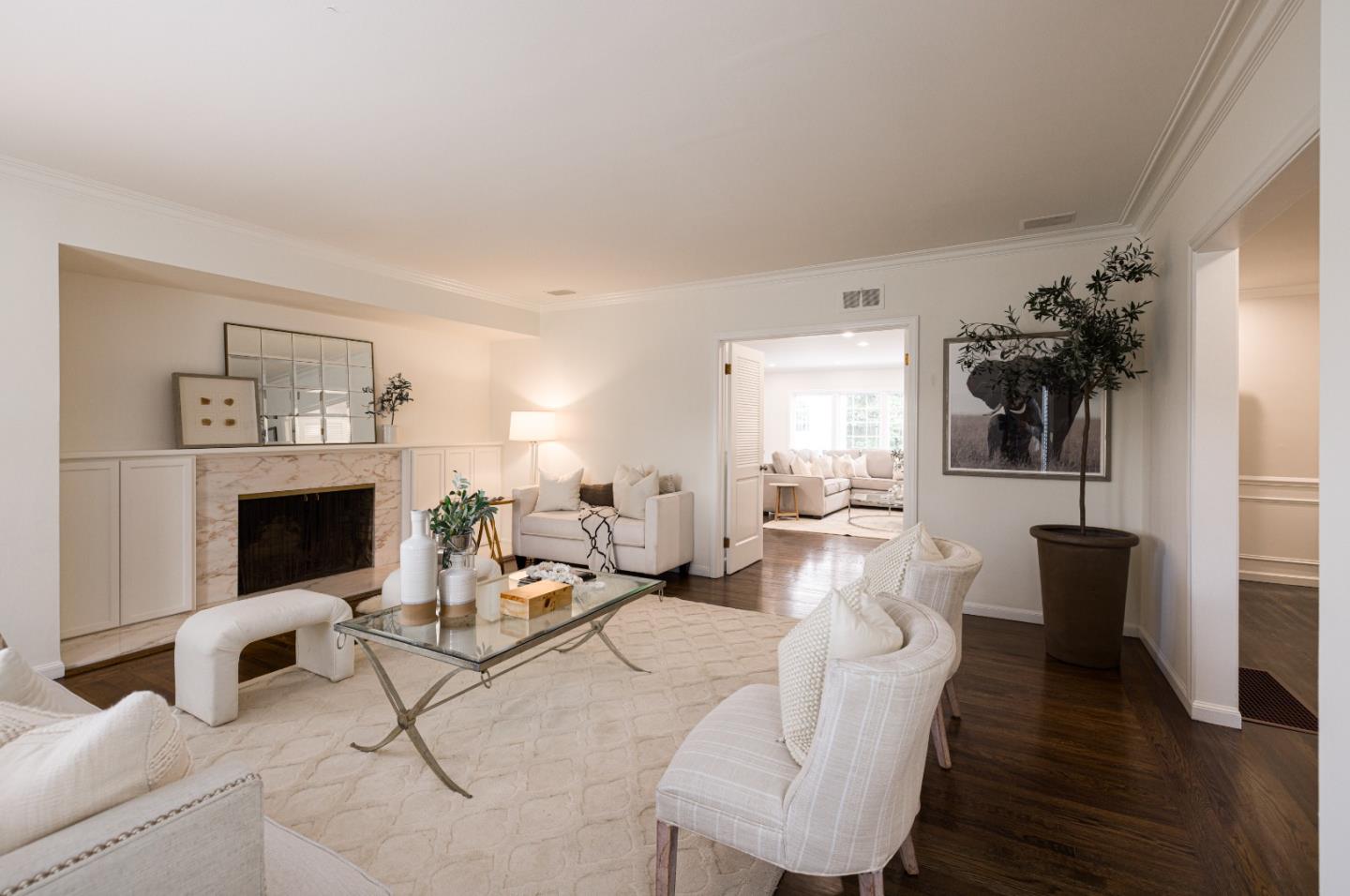 628 Alhambra Road San Mateo, CA 94402 - Photo 4 of 35 a living room with furniture and a fireplace