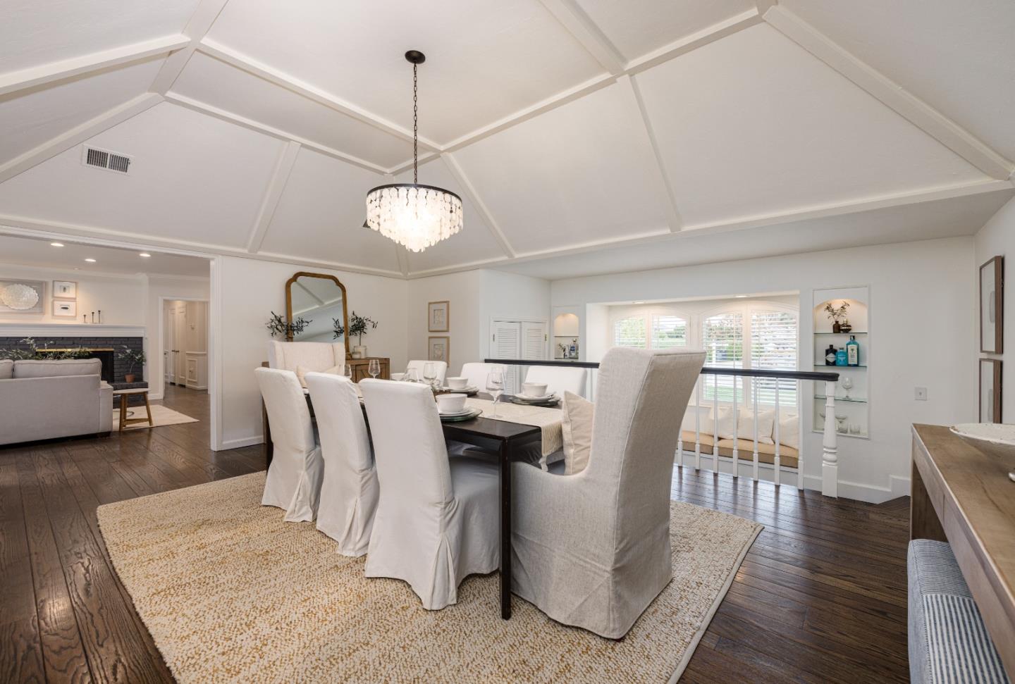 628 Alhambra Road San Mateo, CA 94402 - Photo 9 of 35 a dining room with furniture a chandelier and wooden floor